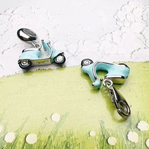 Light blue scooter charms.