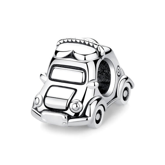 A silver clip-on charm shaped like a vintage classic car with detailed wheels, windows, and decorative roof trim, shown on a white background