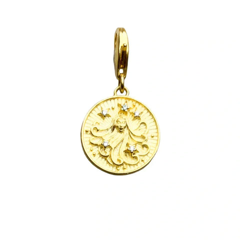 Gold pendant with a woman?s face and star accents.