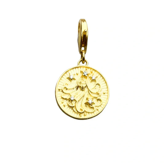 Gold pendant with a woman?s face and star accents.