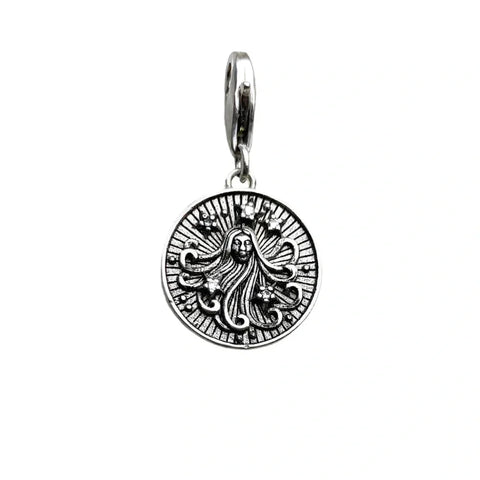 Silver pendant with a woman?s face.