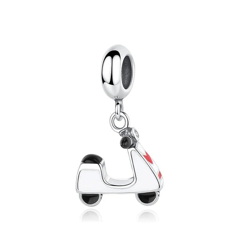 White Enamel Scooter Dangle Charm, Silver Tone - Silver tone dangle charm shaped like a retro motor scooter with white and red enamel bodywork, black enamel wheels, and crystal handlebar accents, shown hanging from a bracelet bead fitting