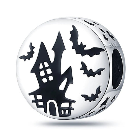 Sterling silver charm featuring a witch on a crescent moon with a Halloween pumpkin.
