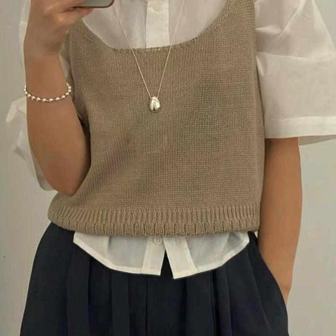 Chic Gold and Silver Teardrop Pendants for Every Occasion - a woman wearing a white shirt and black skirt