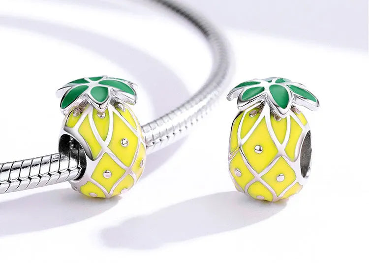 yellow pineapple charm with green top