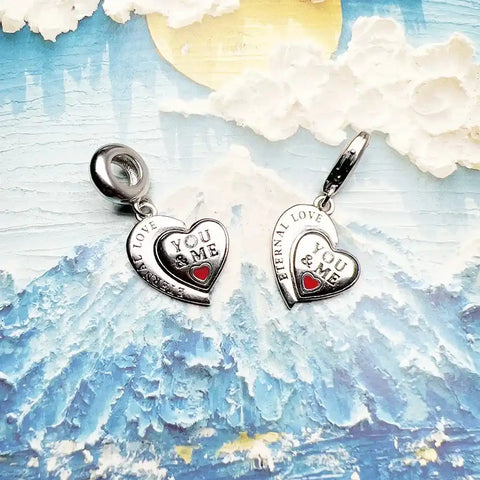 Two silver heart-shaped charms.