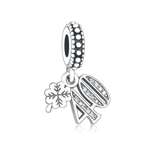 Sterling silver th birthday charm with crystal accents and a four-leaf clover.