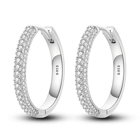 Sophisticated Sterling Silver PavA Huggie Hoop Round Earrings - Sterling silver huggie hoop earrings with pave stones.