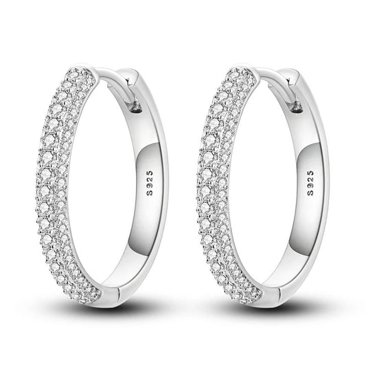 Sterling silver huggie hoop earrings with pave stones.