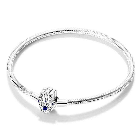 Hamsa Hand Sterling Silver Snake Chain Charm Bracelet - Sterling silver bracelet with an intricate Hamsa hand clasp adorned with blue gemstones.