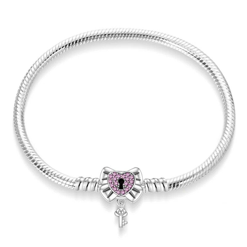 Key to my heart charm sterling silver snake chain bracelet with pink gemstones and keyhole design