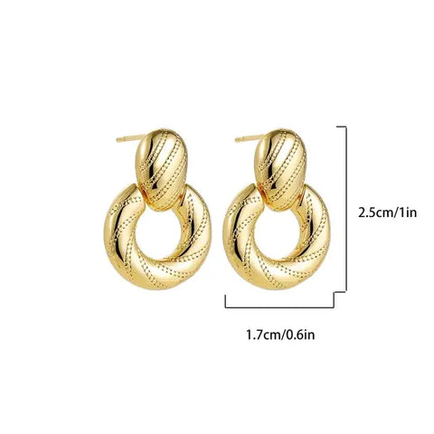 Twisted Gold Hoop Earrings - Bold Statement Jewelry - Twisted gold hoop earrings measuring .cm in height and .cm in width, displayed with dimensions.