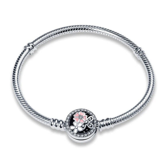 Enchanted Floral Charm Bracelet - Sterling silver bracelet with a floral charm adorned with sparkling stones and pink enamel.