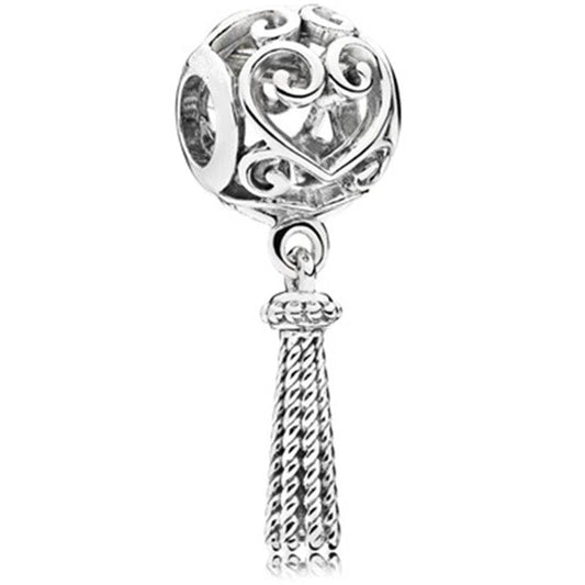 Sterling silver charm featuring an intricately designed heart with a dangling tassel.