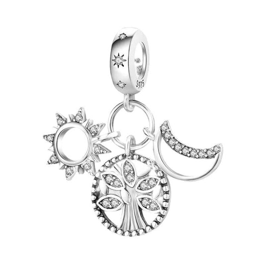 Sterling silver charm featuring sun, moon, and tree designs with sparkling crystals.