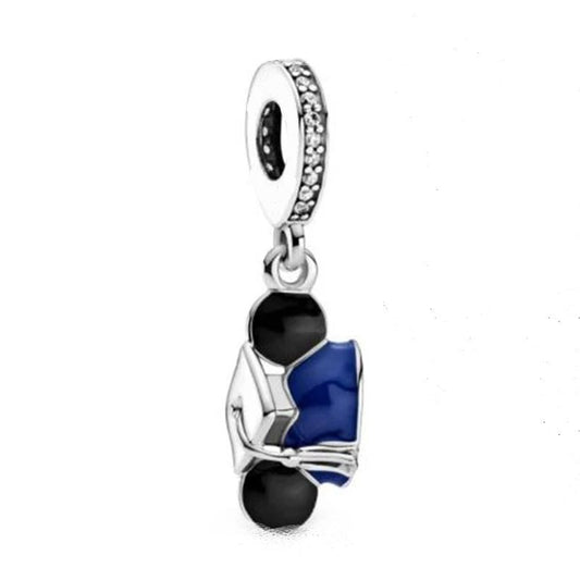 Sterling silver charm featuring a graduation cap with black and blue enamel accents.