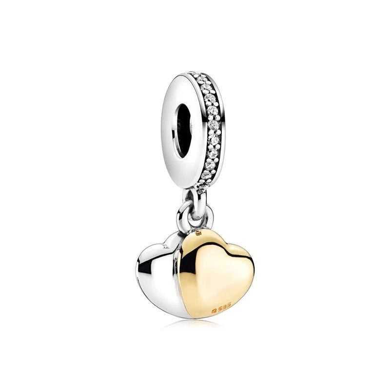 Sterling silver and gold dual tone heart charm with crystal-adorned bail.