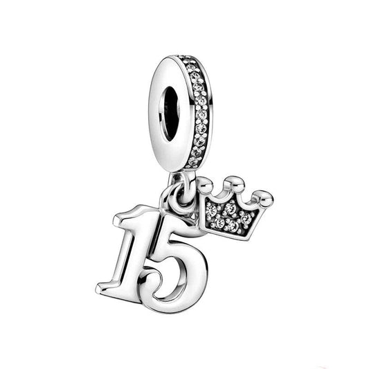 Sterling silver charm with "15" and a sparkling crown.