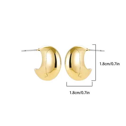 Crescent moon gold earrings measuring .cm in height and width, displayed with dimensions.