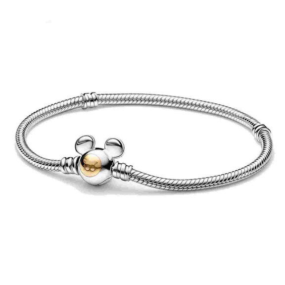 Whimsical Mickey Mouse Charm Bracelet - Sterling silver bracelet with a gold-tone Mickey Mouse head charm, compatible with Pandora charms.