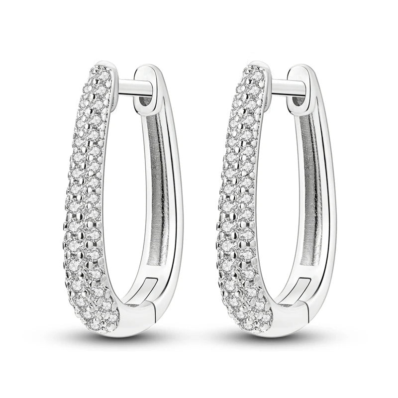 Sterling silver huggie hoop earrings with pavÃ© stones.