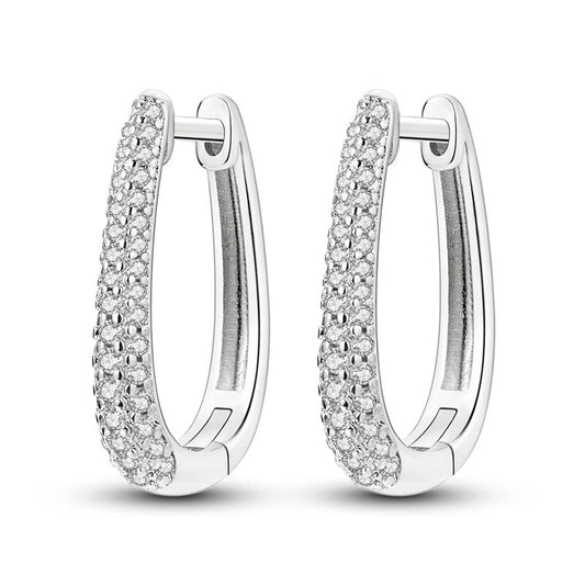 Sterling silver huggie hoop earrings with pavA stones.