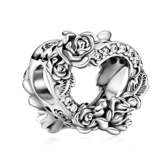 Floral Heart Charm - Sterling silver heart-shaped charm adorned with detailed roses and sparkling crystals.