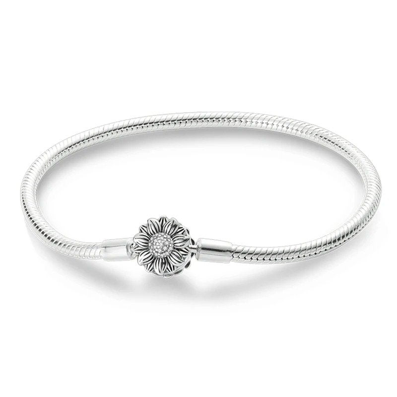 Sterling silver bracelet with a detailed sunflower charm, compatible with Pandora charms.