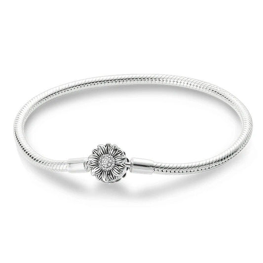 Sterling silver bracelet with a detailed sunflower charm, compatible with Pandora charms.