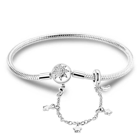 Celestial Starburst Charm Silver Bracelet Delicate Stars - Silver bracelet with a starburst charm and delicate dangling stars.