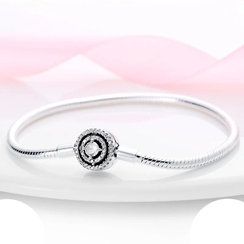 Radiant Spiral Sterling Silver Charm Bracelet with crystal spiral charm.