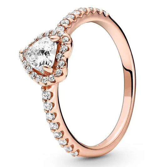 Rose Gold Ring with White Heart-Shaped Gemstone and Diamond Accents