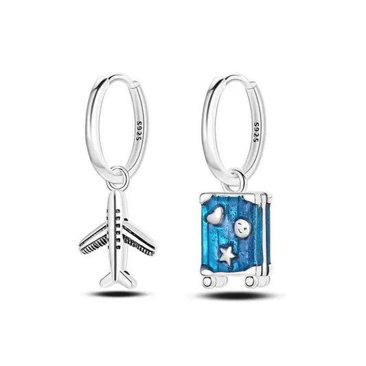 Sterling silver travel charm earrings with airplane and suitcase charms.