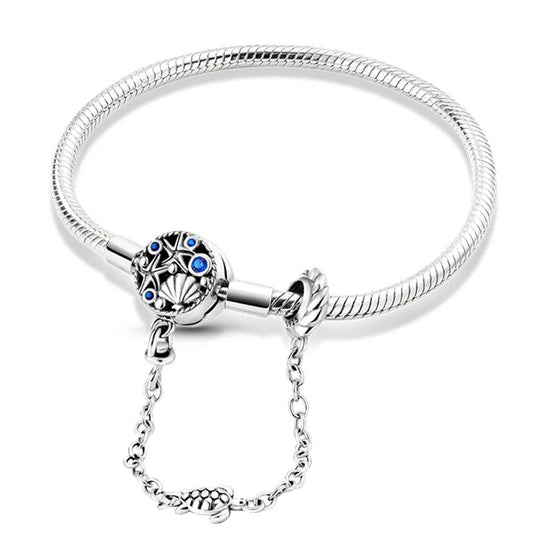 Ocean treasures charm sterling silver snake chain bracelet with sea engravings, blue crystals,.