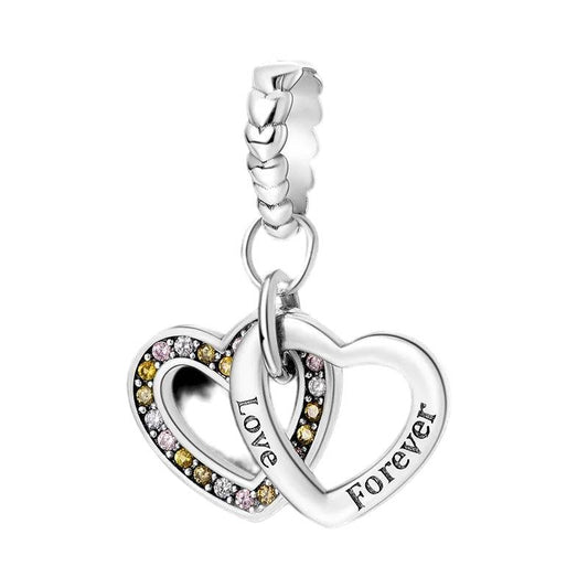 Sterling silver charm with two interlocking hearts, one with cubic zirconia.