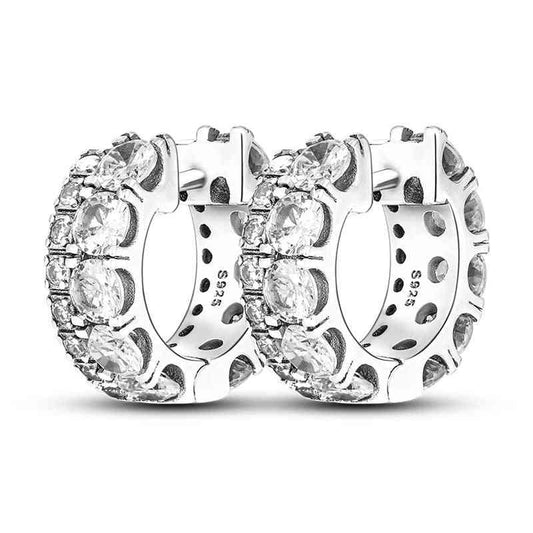 Sterling silver wide hoop earrings adorned with sparkling diamonds.