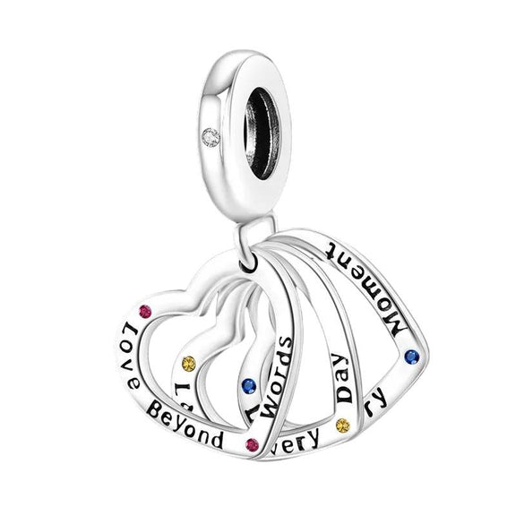 Multicolored Heart Charm for Pandora Bracelets - Sterling silver charm with interlocking hearts and multicolored cubic zirconia.