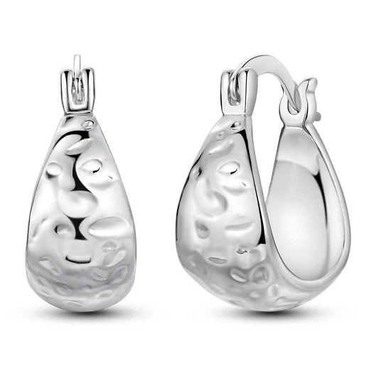 Sterling silver hammered teardrop hoop earrings with unique texture.