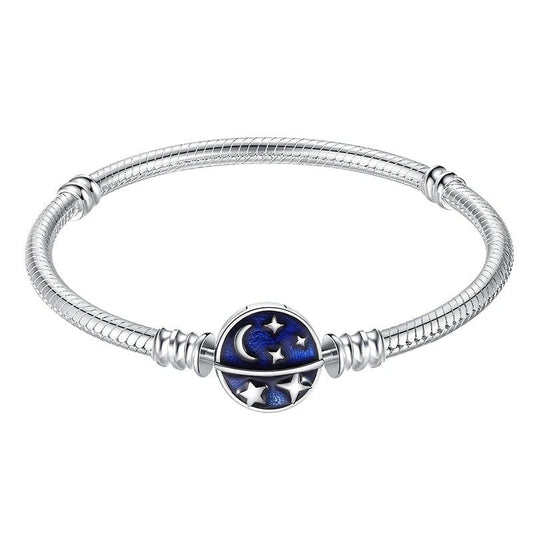 Celestial Night Sky Charm Bracelet with moon and stars charm on blue enamel.