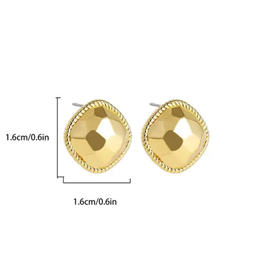 Faceted gold stud earrings measuring .cm in height and width, displayed with dimensions.